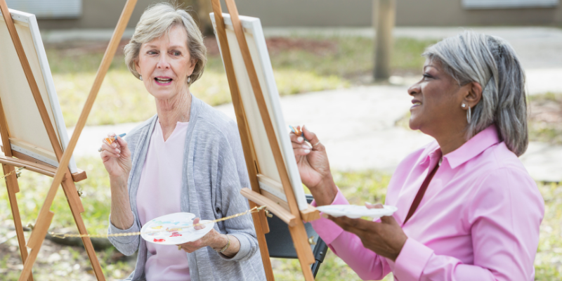 Outdoor-exercise-1 Two senior women outside painting