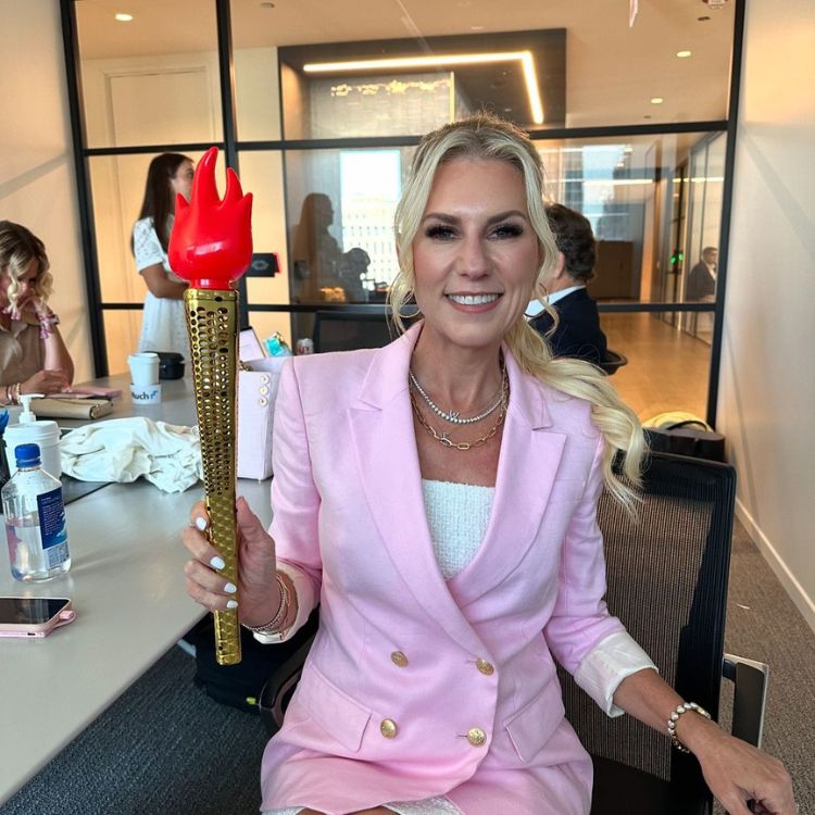 Sevy Petras in pink with a torch.