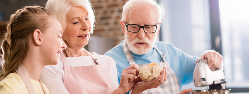 Untitled-design-11 A senior couple baking with their granddaughter